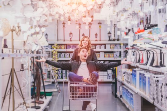 young couple shopping for DIY tools at hardware store.cheerful young couple shopping in hardware store