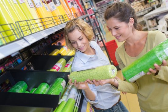 2 female friends buying home decoration at hardware store