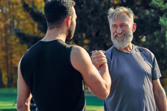 The two happy sportsmen greeting outdoor